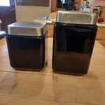 Set Of 2 Black Amethyst Square Art Deco Glass Canisters With Stainless Lids. Fixed Price $25.00.
