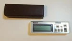 Comus TC-10 Miniature Portable Liquid Crystal Alarm Clock Battery Operated. Fixed Price $25.00.